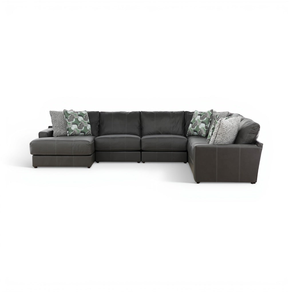 Dark gray sectional with right chaise, camo accent pillows, and padded armrests