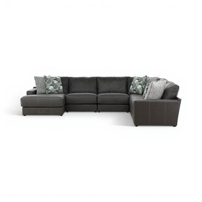 Dark gray sectional with right chaise, camo accent pillows, and padded armrests
