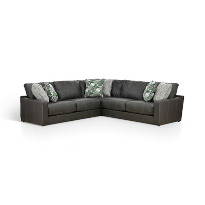 Dark gray L-shaped sectional sofa with green camo and textured gray pillows