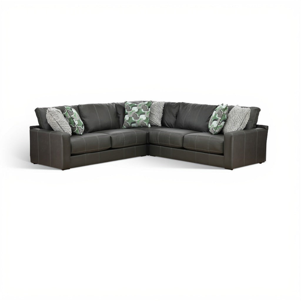 Dark gray 3-piece sectional sofa with green camo and gray accent pillows