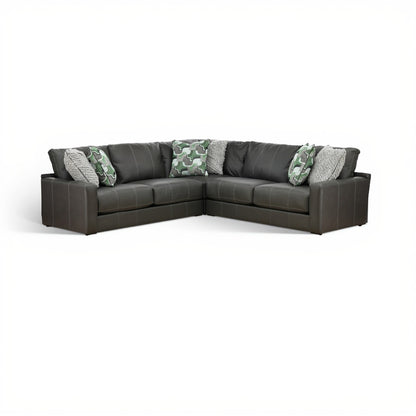 Dark gray 3-piece sectional sofa with green camo and gray accent pillows
