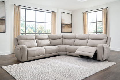 Light gray sectional sofa with power recline, extended footrests, and control switches on arms