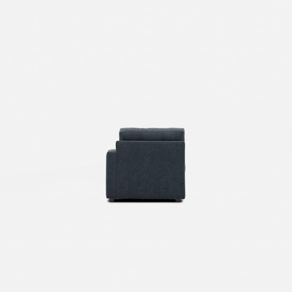Dark navy modular one-chaise sectional chair with tufted backrest and arms
