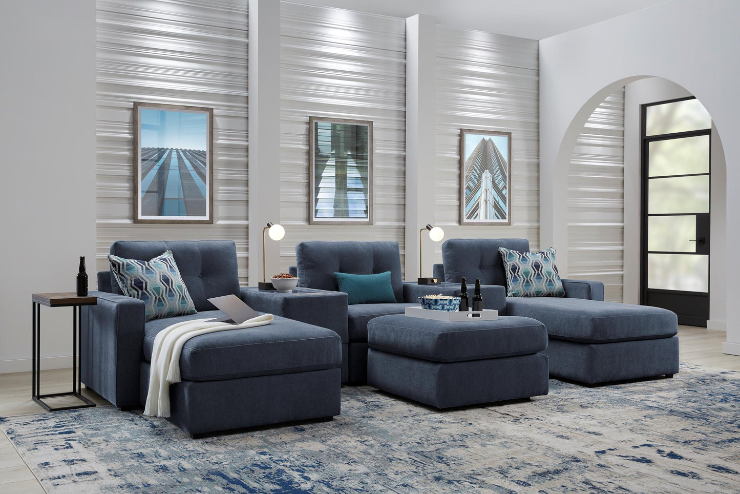 Modular theater sectional with dual chaises in dark navy, staged living room view with cushions.