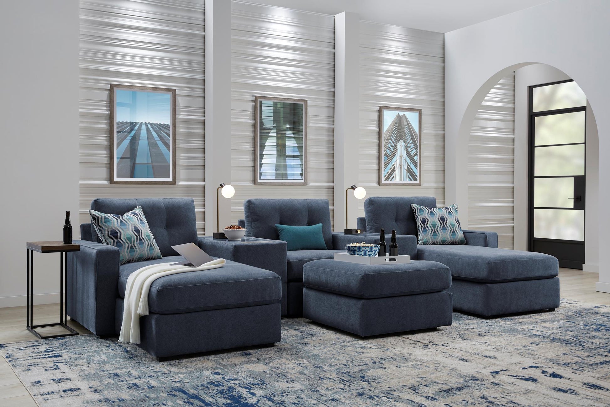 Modular theater sectional with dual chaises in dark navy, staged living room view with cushions.