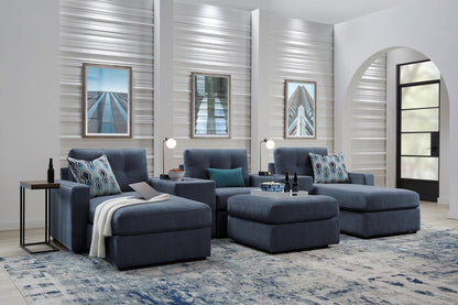 Modular theater sectional with dual chaises in dark navy, staged living room view with cushions.