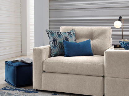Light beige modular chair with armrests and two throw pillows on the seat