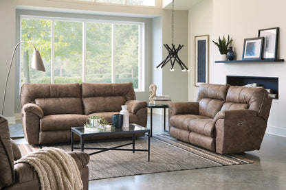 Living room view of brown power reclining sofa and matching reclining loveseat.