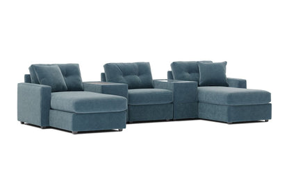 Teal theater sectional with dual chaise configuration and deep tufted seat cushions.