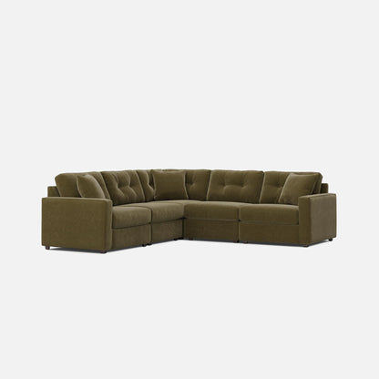 Olive green modular sectional sofa with tufted back cushions and chaise corner.
