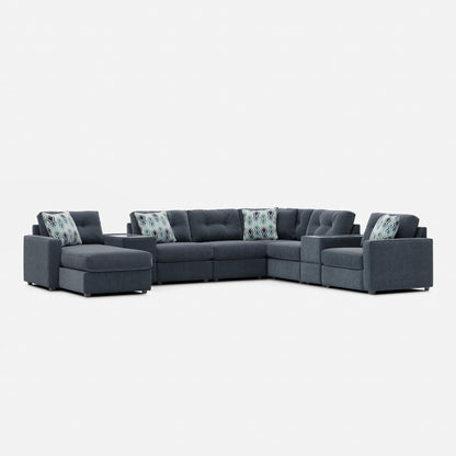 Dark gray modular sectional sofa with patterned accent pillows and square arms
