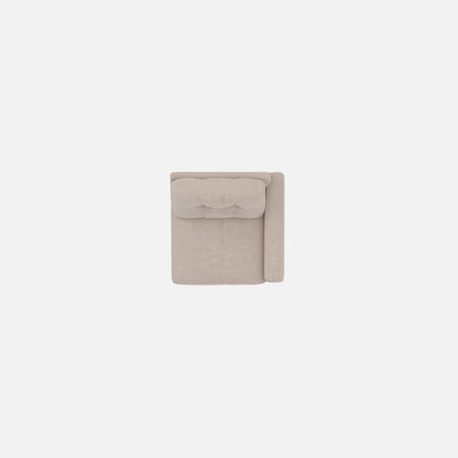 Beige upholstered modular chair with tufted back detail and clean straight edges