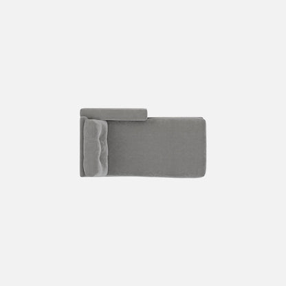 Gray chaise seat and backrest end panels, fabric upholstery close-up