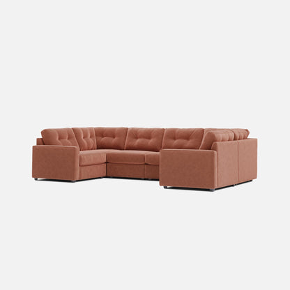 Terracotta sectional sofa with chaise corner, tufted seat cushions, and wide armrests