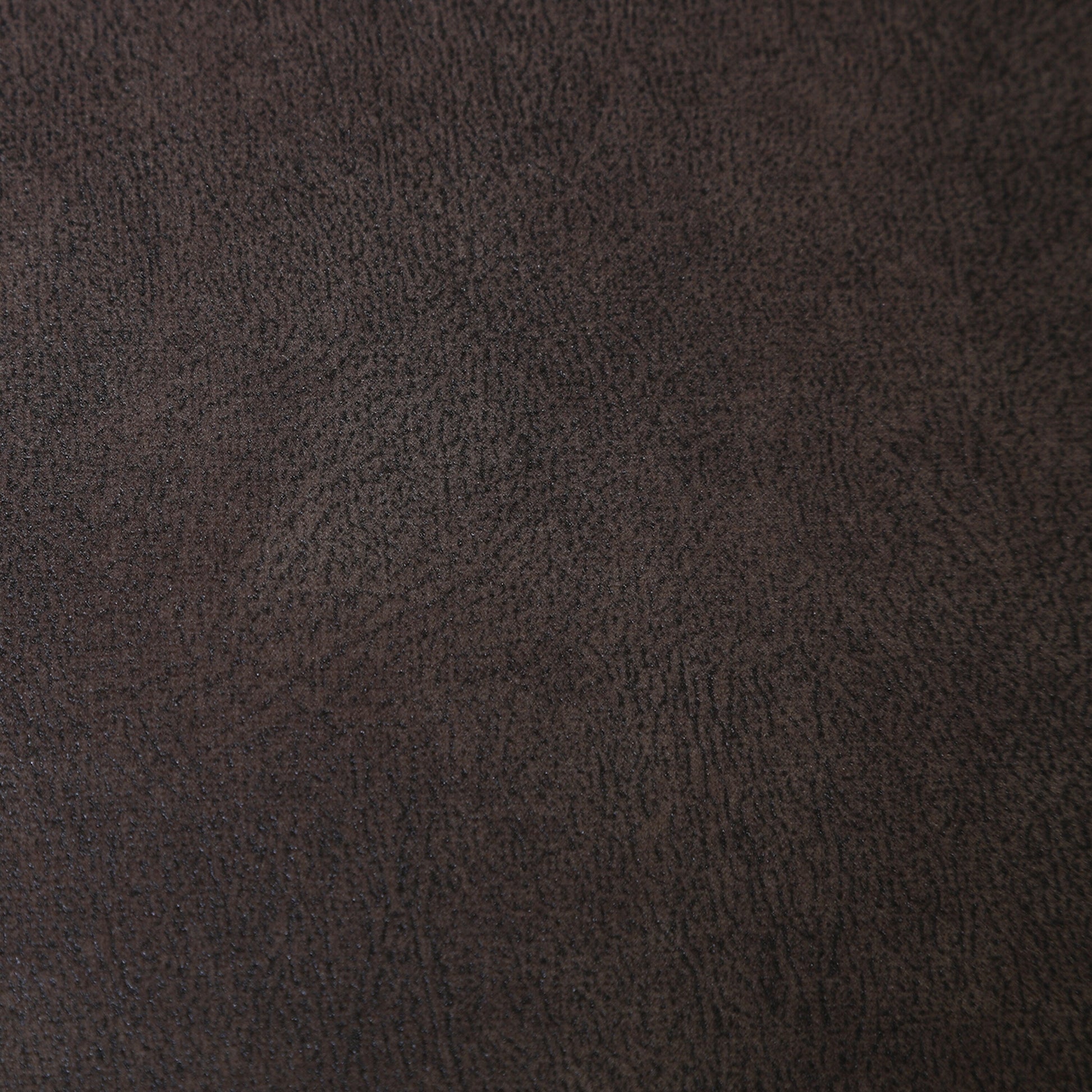 Brown textured upholstery close-up with fine grain pattern.