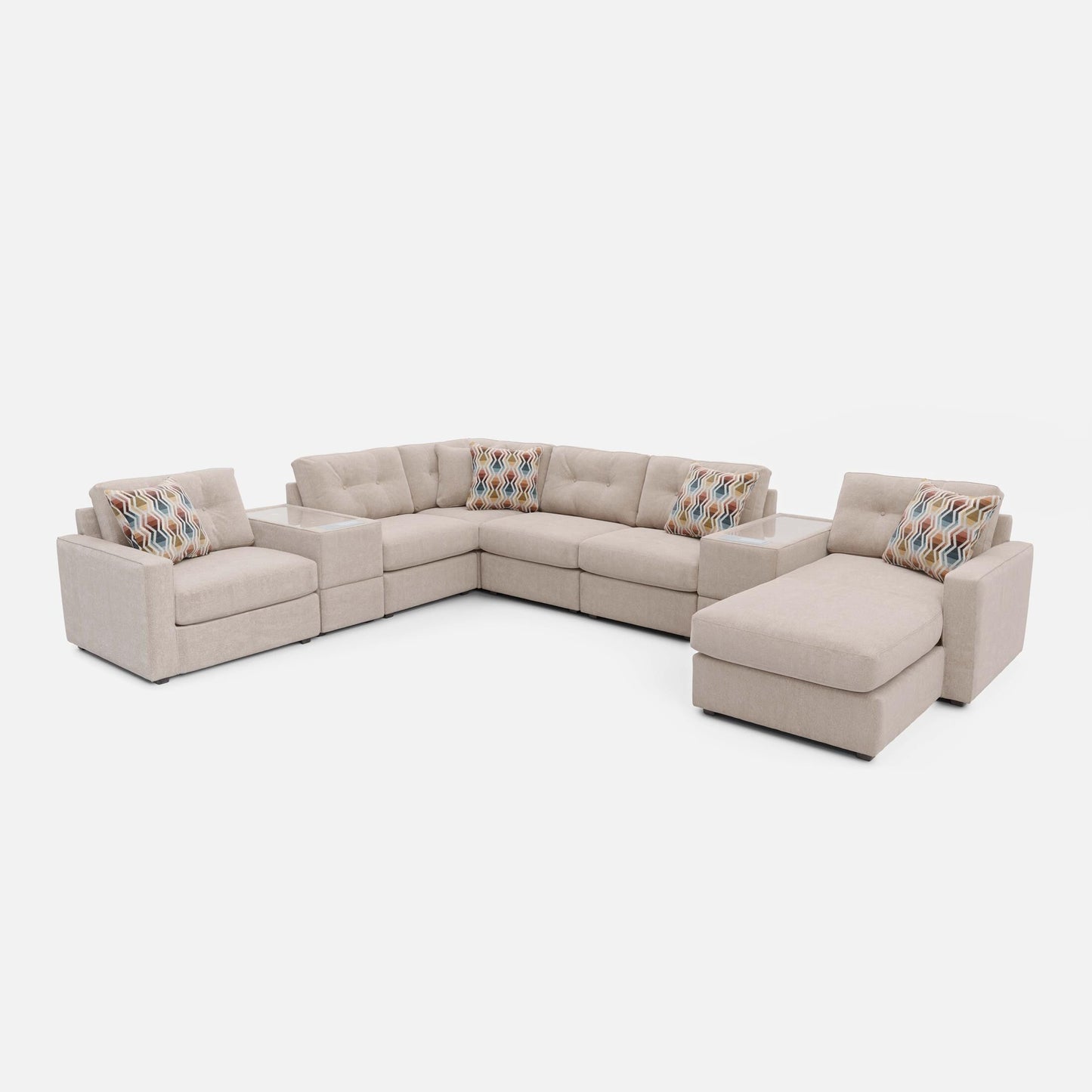 Light beige modular sectional sofa with chaise and colorful patterned throw pillows.