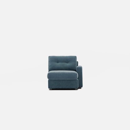 Upholstered chaise lounge with tufted backrest and rounded arm in teal-blue fabric