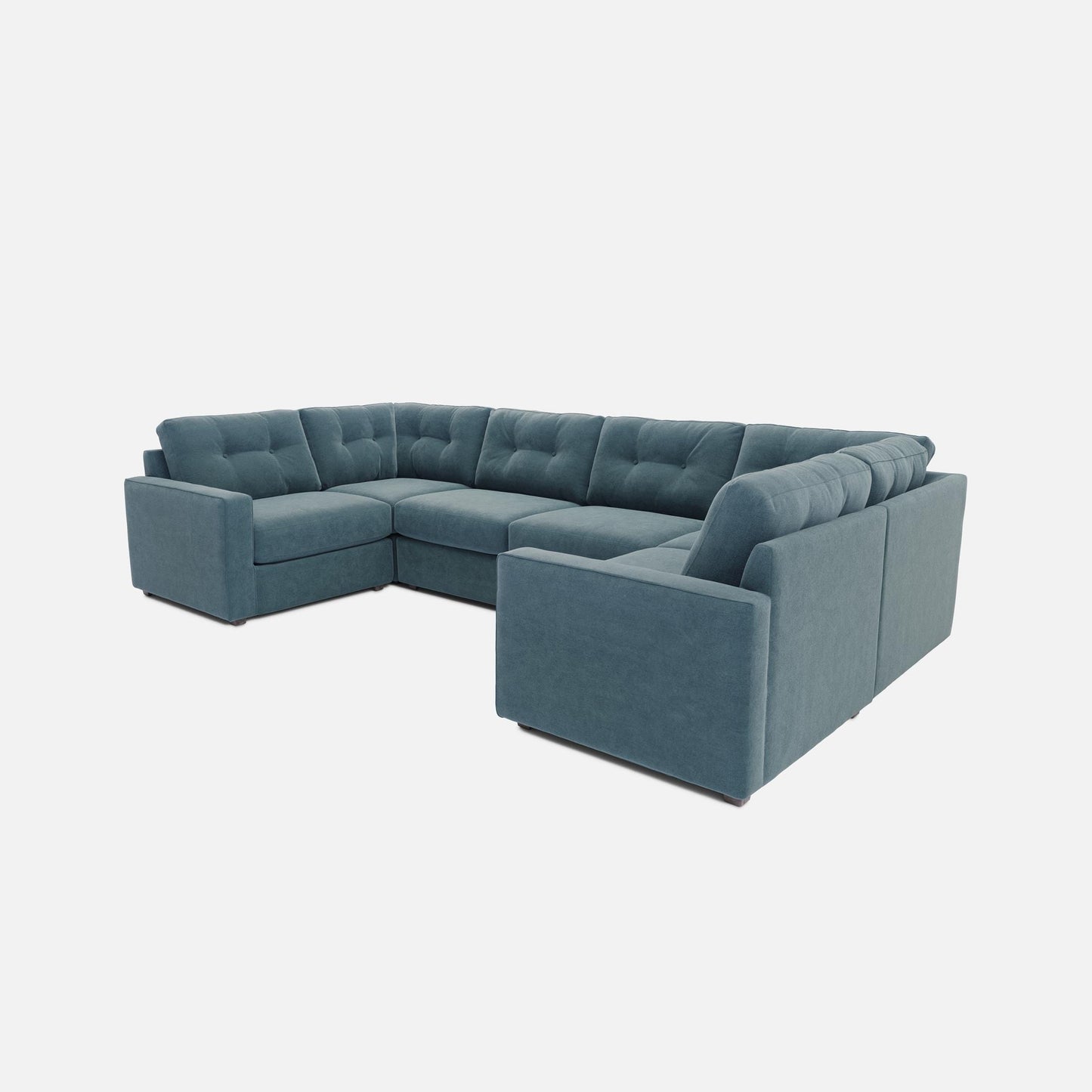 Teal sectional sofa with chaise corner and tufted seat backs, modular 6-piece layout