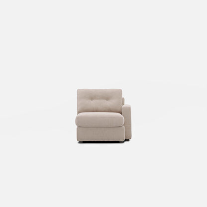 Beige modular one chaise with tufted backrest and padded arm, front view