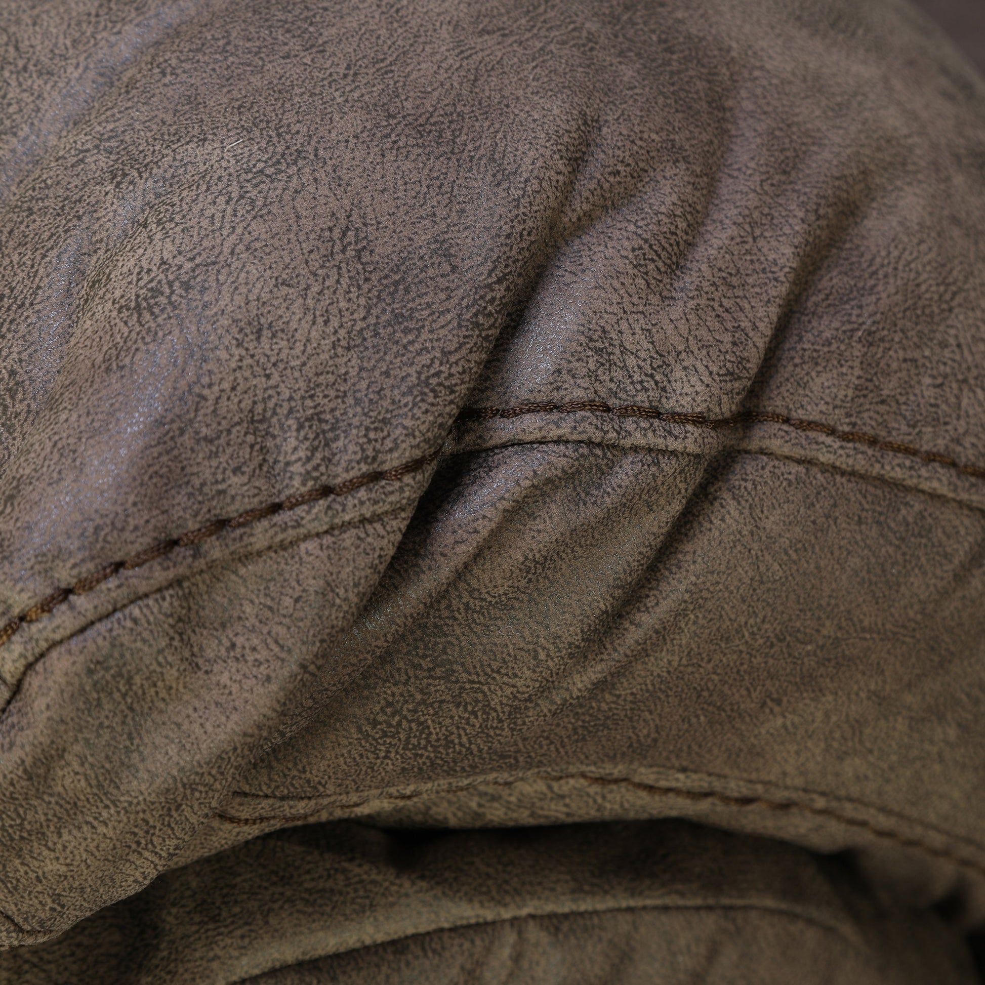 Dark brown loveseat seat cushion with curved stitched channels
