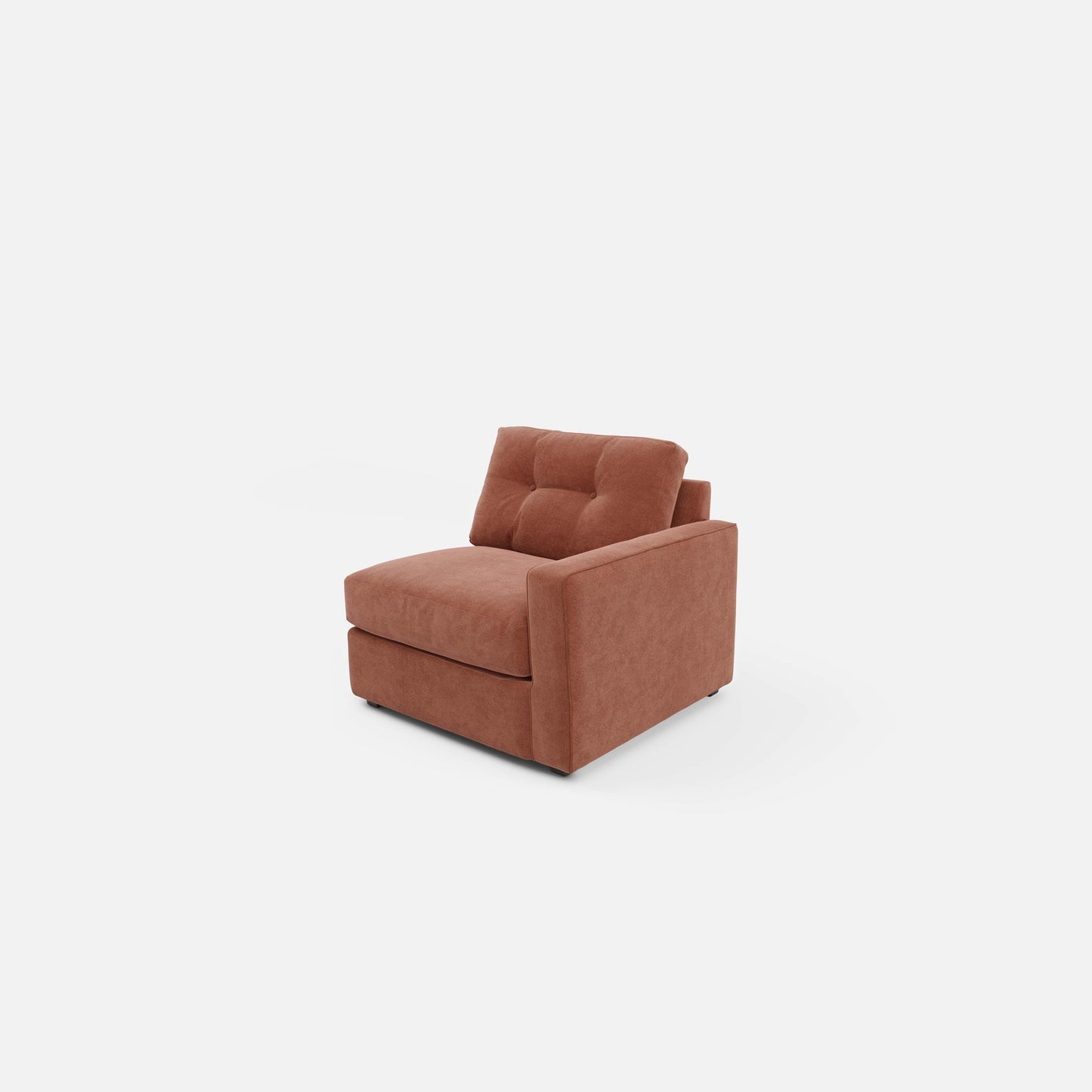 Upholstered armchair in terracotta, angled view with tufted headrest and cushioned arms