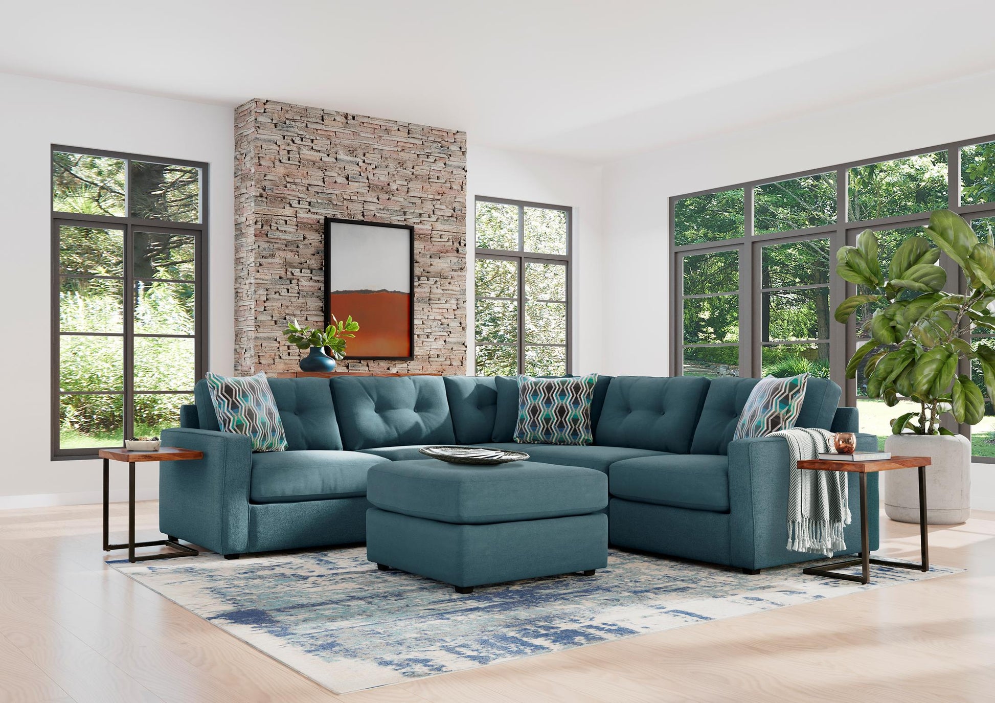 Teal sectional sofa with matching ottoman in a living room setting.