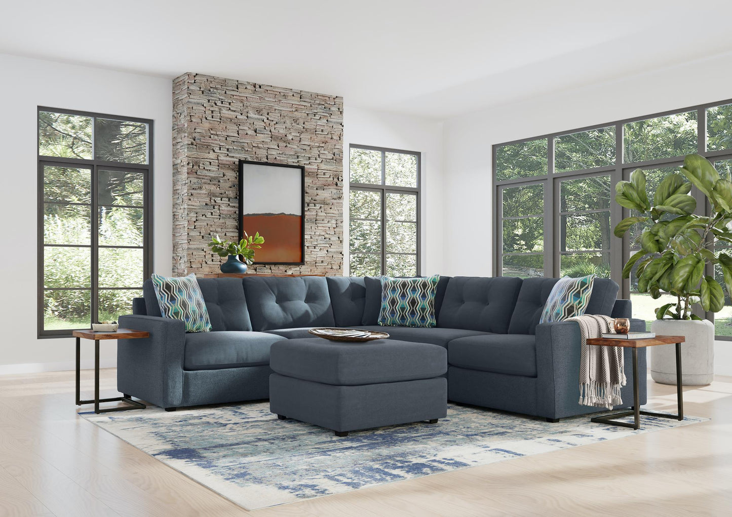 Navy-gray modular sectional sofa with ottoman and patterned throw pillows