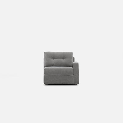 Gray upholstered modular chair with tufted back cushion and square arm profile