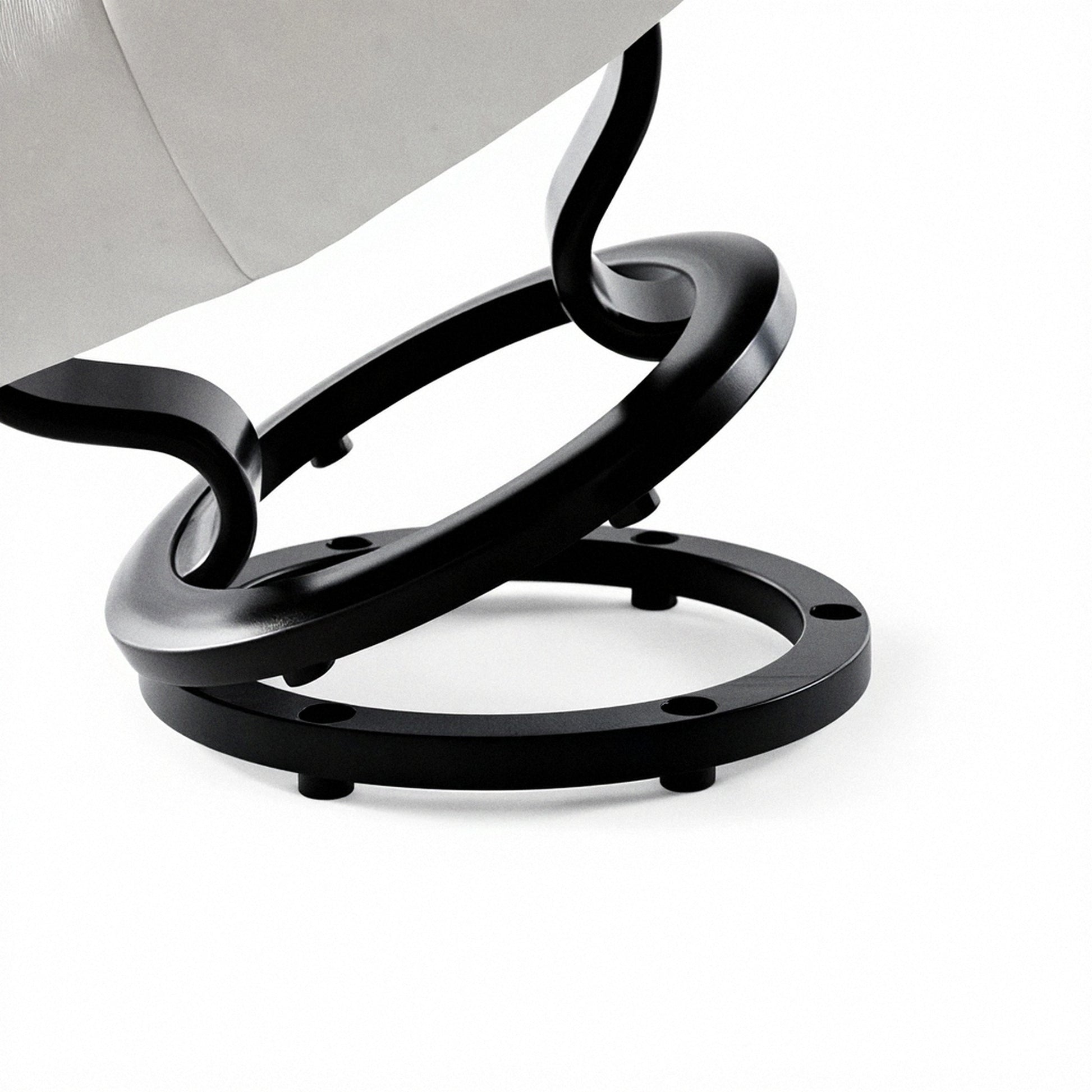 Black circular ottoman elevator ring with four support feet and cutout holes