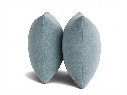 Pair of light blue 22" knife-edge throw pillows, showing tapered side profile