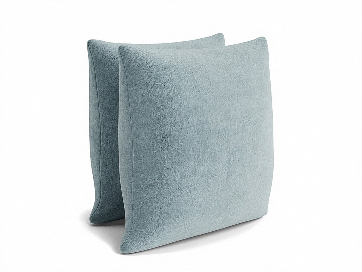Light blue 22" square pillow, angled view, knife-edge seams and plush texture