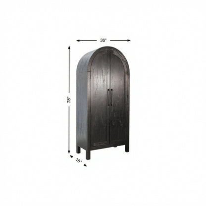 Arched storage cabinet with dark gray wood finish and two-panel doors with central handle