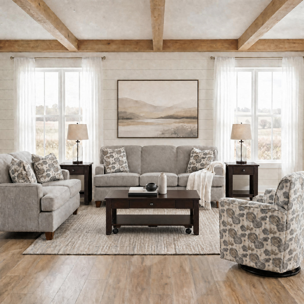 Beige sofa set with patterned pillows in a living room setting