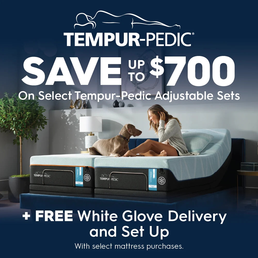 A promotional ad for Tempur-Pedic adjustable mattresses showing a woman and a dog sitting on a mattress in a bedroom setting, with large text offering savings up to $700 and free white glove delivery and set up with select mattress purchases.